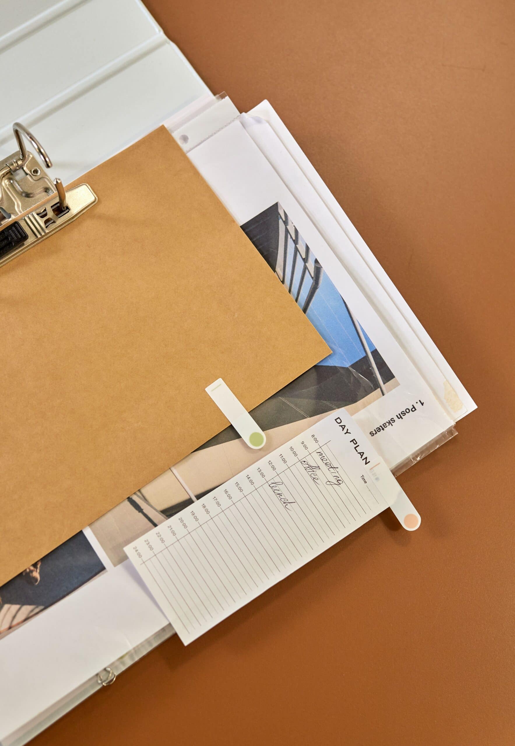 Planner and documents organized on a desk for prioritizing urgent tasks